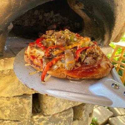 Sign up for one of our Field-to-Table pizza dinners! We make them with fresh, local ingredients in our outdoor, mud pizza oven!