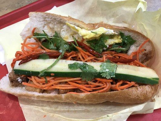 Tofu Banh mi with fried egg over hard and no onions -- yummy $7.50 plus taxes