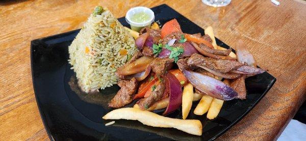 Lomo saltado with cilantro rice. Delicious!!!