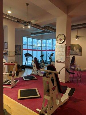 Better shot of the 3 cardio machines in the corner - treadmill, bike, and elliptical.