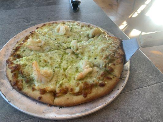 Shrimp, pesto, and three cheeses pizza