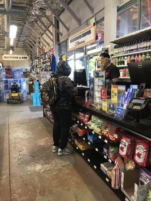 Friendly cashier helping a customer