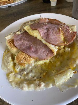 Biscuits and gravy eggs over easy and ham