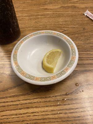 A dirty bowl with lemons for my water, and a hair