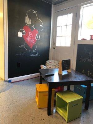 Waiting area with a chalkboard wall