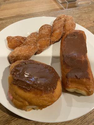 Cinnamon twist, chocolate filled chocolate donut, Bavarian cream filled chocolate donut