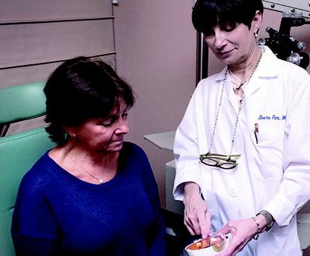 Dr. Laura Fox is committed to patient education explaining her initial findings to a patient.