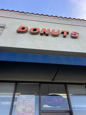 Another sign from another angle. Also, the croissant sign is in the glass.