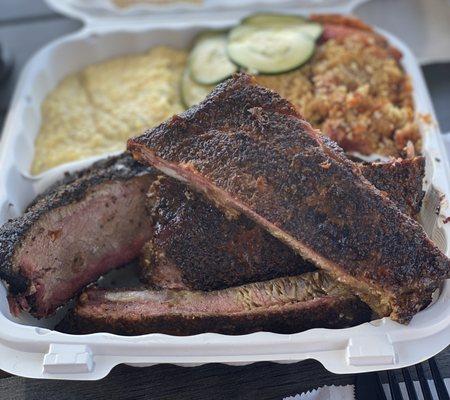 My sons juicy as fuck brisket, ribs, Tomato pie that's TO DIE FOR!! and cheesy pepper grits...