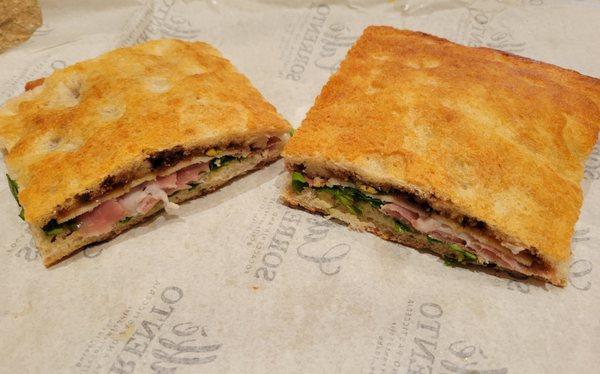 Dino sandwich - cut in half & amply feeds 2 - focaccia, prosciutto, pistachio, fig arugula provolone - delicioso!