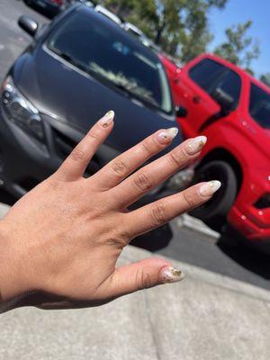 Graduation marble nails with a golden speck.