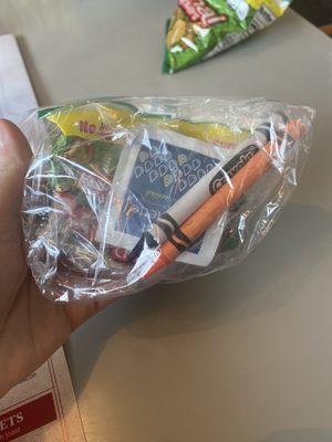 Little kid's baggie with snack and crayons