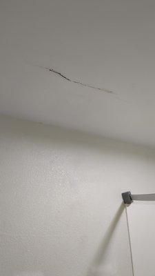 Bathroom ceiling was cracked and had water spots and/or mold on the ceiling.  Room 104