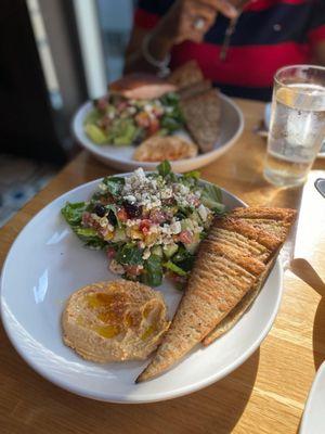 Greek Salad with Hummus and warmed multigrain Pita (background has salmon on top)