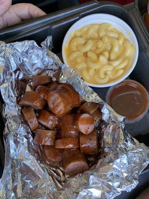 Sausage plate with bbq sauce and Mac and cheese