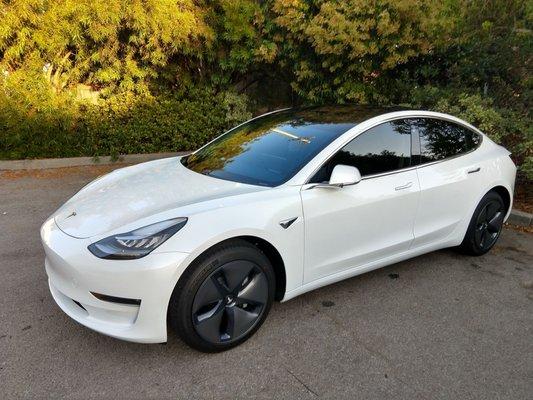 2018 Tesla Model 3 with the works...complete ultra-premium LLumar Stratos window tint and full front LLumar self-healing clear bra.