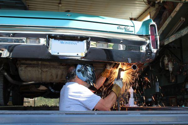 Jerry welding on a tailpipe