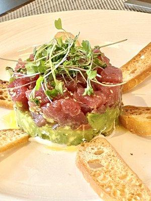 TUNA TARTARE raw sushi grade tuna, sesame seeds, avocado, lemon zest, sour cream, taro root chips