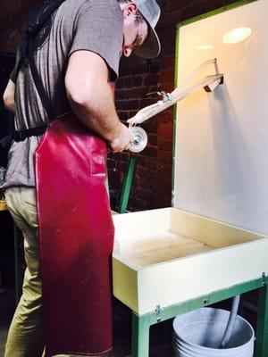 Matthew working hard, making a custom finger print glass.