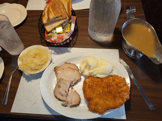 Combo Breaded pork Tenderloin and Roast Pork, mashed potatoes, Sauerkraut . Fresh bread and gravy