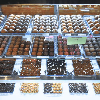 Chocolate display with Chocolate Truffles and other chocolates and chocolate covered candy.