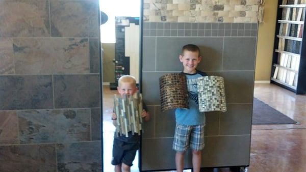 Jaxon and Jase helping display at the shop!