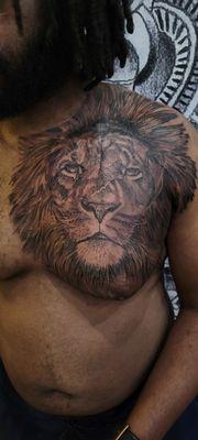 Big lion tattoo on the chest