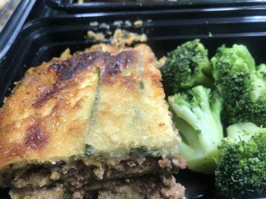 Zucchini Lasagna topped with parmesan cheese and a side of broccoli