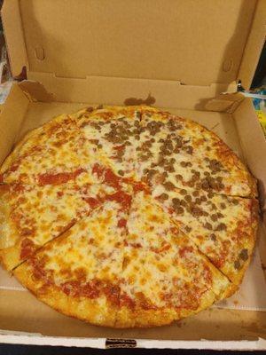 Half cheese half ground beef pizza. Not worth the Price