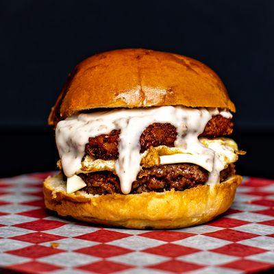 HASH TAG BURGER
Beef patty topped w/hash brown, white American cheese, fried egg, and white sausage gravy.