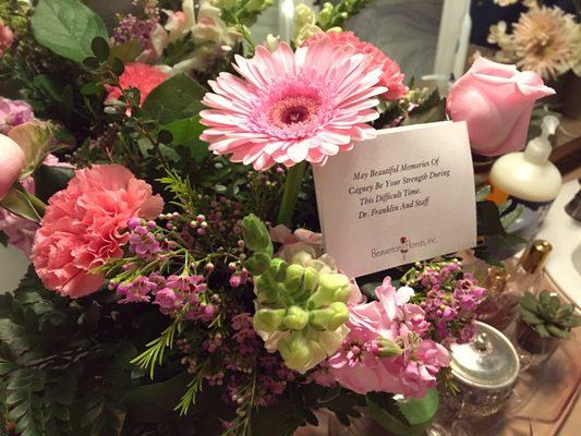 The beautiful bouquet with condolences attached from Dr. Franklin and the staff.