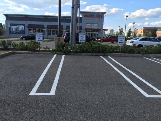 Customer designated parking spaces face Trader Joe's.