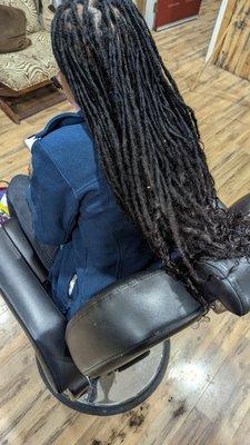 Retwist and dread extensions with curly ends.