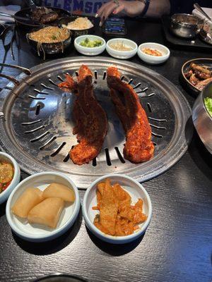 Spicy pork being cooked at the table.