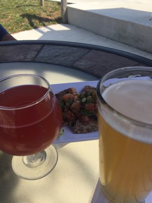 Beers and Bruschetta on spent grain crackers.