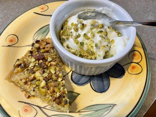 1/2 order of Basbousa, topped with pistachios. Mehliyaeh (pudding). GREAT combo!