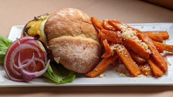 Local Bison Burger | 
 potato bun * roasted garlic aioli * lettuce * tomato * onion * Tillamook  cheddar * truffle sweet potato fries