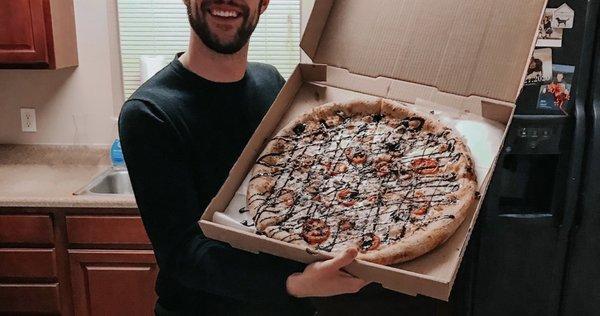 My incredible husband and his favorite Caprese Pizza