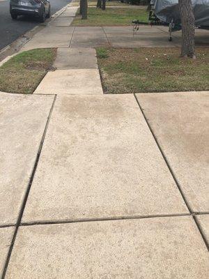 Our driveway is still a little wet in this image, but look at the difference between ours and our neighbor's after the pressure washing!