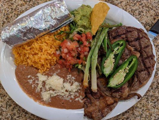 Carne asada, steak mid-rare and cooked as ordered.