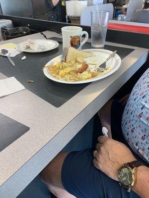 Scramble eggs, hash browns, bacon and toast