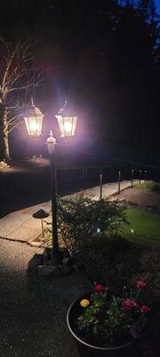 Conversion of plug in lamp to landscape lighting and stair railing lights added to landscape light array.