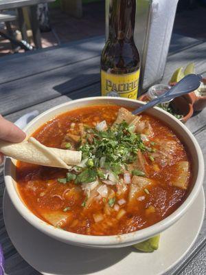 Menudo with garnishings.