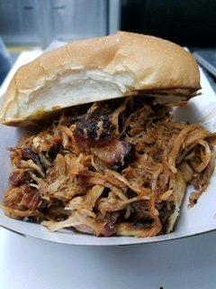 Juicy, Smoked Pulled Pork on a Toasted White Bun. Served with Chips on the side!