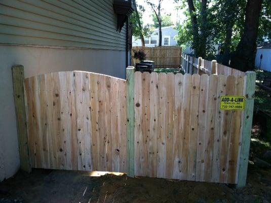 Solid Cedar Fence with Crown Top Gate