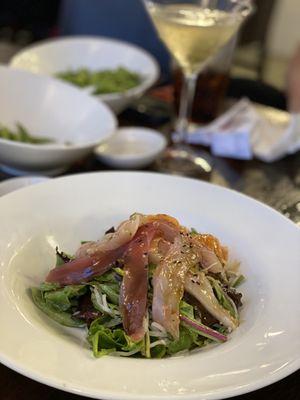 chirashi salad, over udon, greens and wasabi ginger dressing