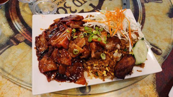 Roast pork platter with fried rice.