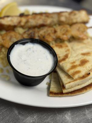 Tangy tzatziki comes with the skewers. Yum