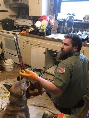 James, explaining the finer points of plumbing to my pup.