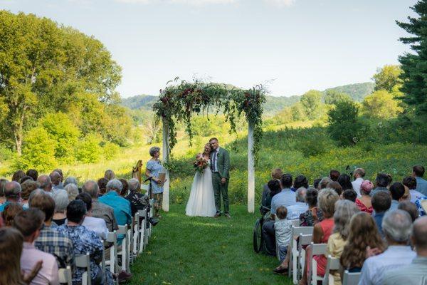 The arbor and bouquet designed by Clementine at Round Barn Farm